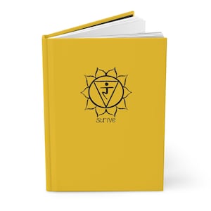 May include: A yellow journal with a black symbol and the word "strive" printed on the cover.