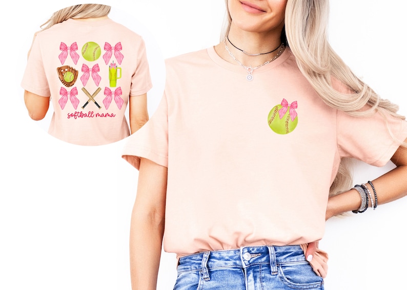 May include: A pink t-shirt with a softball design on the front and back. The front design features a single softball with a pink bow. The back design features a softball, bats, a glove, and a drink with pink bows around each item. The text "softball mama" is printed below the design.