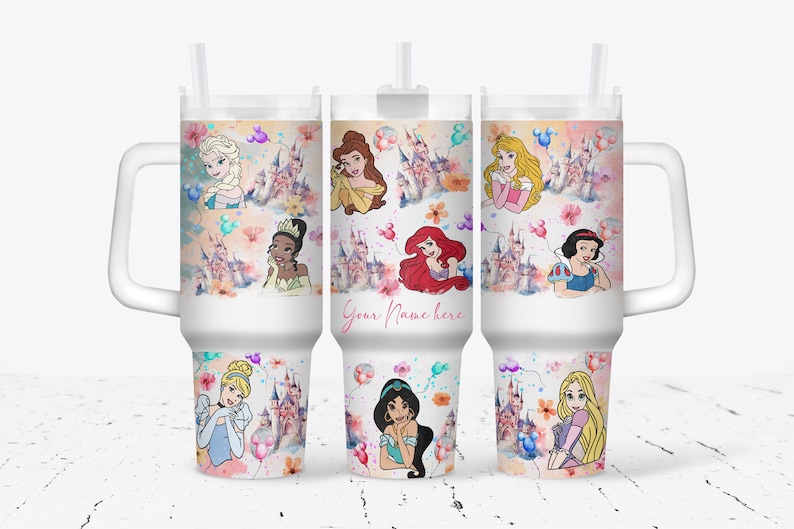 May include: White tumbler with a handle and a straw. The tumbler features a colorful design with Disney princesses, castles, and balloons. The text "Your Name Here" is printed on the tumbler.