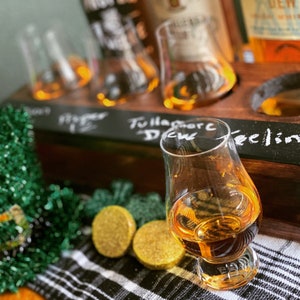 Handcrafted Whiskey flight crate setup with Irish whiskies and glencairns.