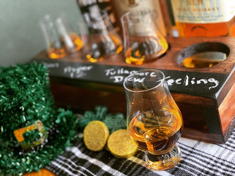 Handcrafted Whiskey flight crate setup with Irish whiskies and glencairns.
