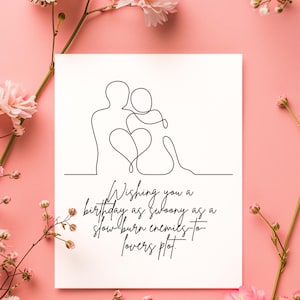 May include: A white greeting card with a black line drawing of two figures embracing, with a heart shape in the middle. The card has the text: "Wishing you a birthday as swoony as a slow-burn enemies-to-lovers plot."