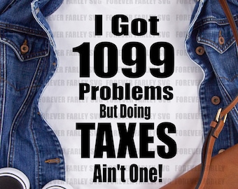 May include: A white t-shirt with black text that reads "I Got 1099 Problems But Doing Taxes Ain't One!" The shirt is displayed on a wooden surface with a blue denim jacket and a brown leather purse.