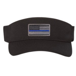 May include: Black visor with a thin blue line American flag patch. The flag is silver and blue with a thin blue line across the middle.