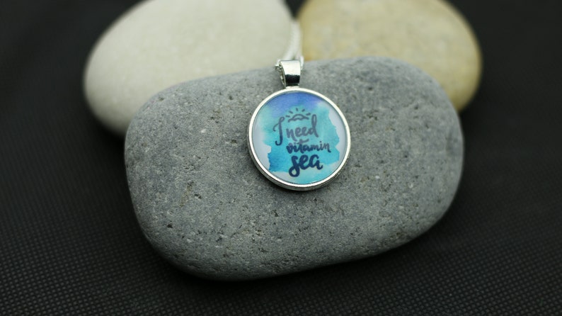 Necklace with sea lettering I need Vitamin Sea by self-painted watercolor painting under cabochon in the color silver