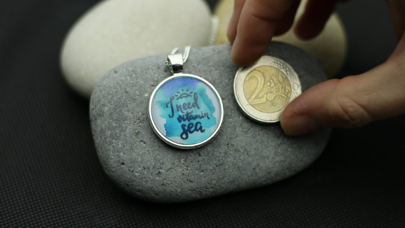 Necklace with sea lettering I need Vitamin Sea by self-painted watercolor painting under cabochon in the color silver