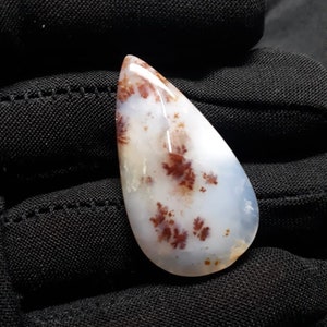 Lot 157. Natural Tree Agate pear cabochon.