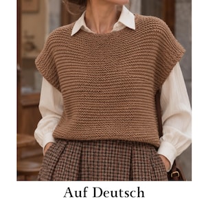 May include: A sleeveless brown knit sweater vest with a textured garter stitch pattern, worn over a long-sleeved white collared shirt and a brown and black plaid skirt. The outfit features a classic layered look with neutral earth tones.