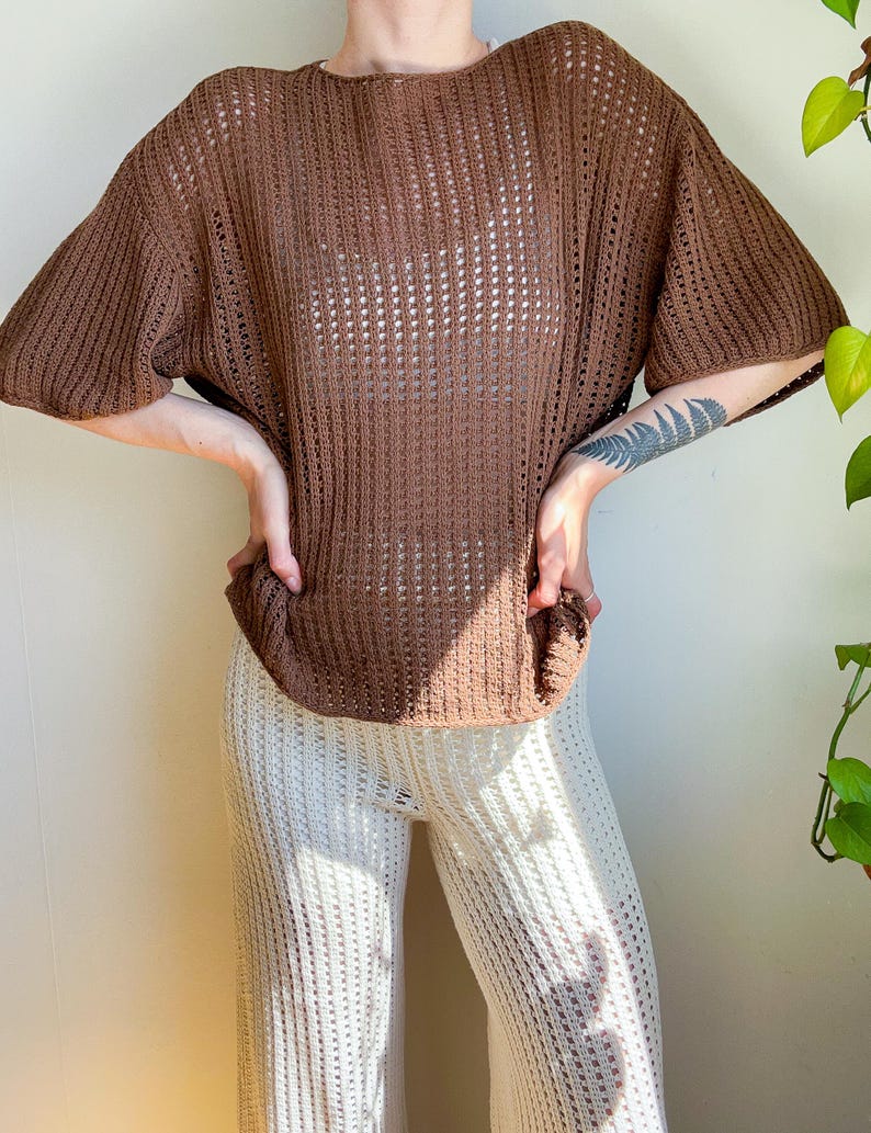 May include: A set of three ceramic mugs with a speckled, matte finish. The mugs are in shades of cream, light gray, and dark gray. Each mug has a simple, minimalist design, perfect for coffee or tea.