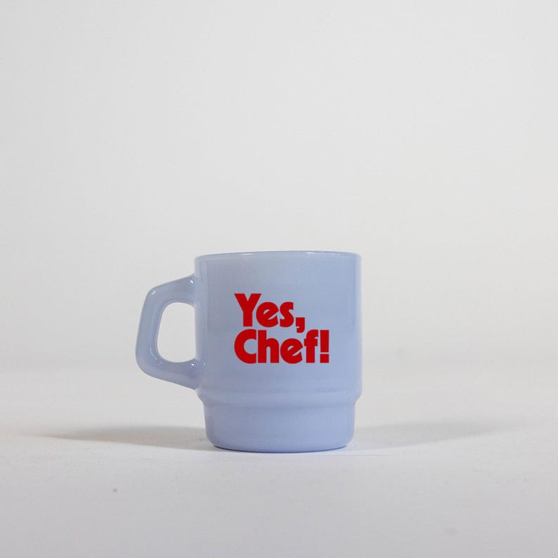 May include: A light blue ceramic mug with a red "Yes, Chef!" graphic.
