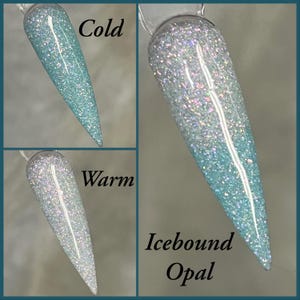 May include: A set of three nail swatches showcasing a color-changing effect. The top swatch is a solid light blue, the bottom is a silver-white, and the center swatch is a gradient. The text "Cold", "Warm", and "Icebound Opal" are included.