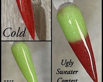 May include: Three nail polish swatches. One is red with glitter and the word "Cold". Another is green with glitter and the word "Warm". The third is green and red with glitter and the words "Ugly Sweater Contest".
