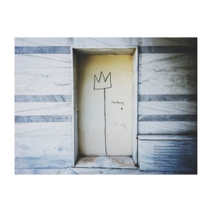 May include: A white door with a black drawing of a crown on a stick with the word "Thinking" written below it.