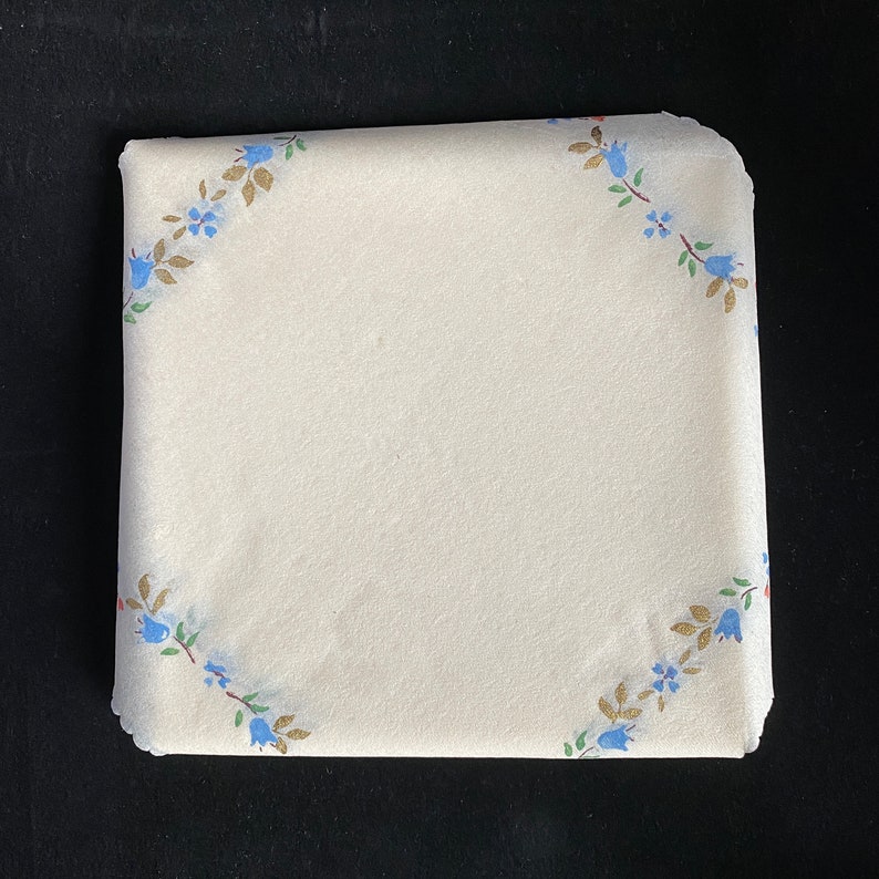 Swan Mill Crepe Napkins with Gold Accents and Blue and Pink Flowers