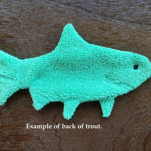 This is a view of the back side of the Rainbow Trout Smudge Fish. The back side is a solid color. Text in photo reads:  Example of back of trout.