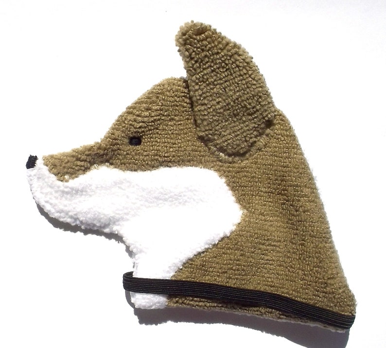 Soft, microfiber terry cloth towels cut, sewn, and made in the shape of the head of a Shiba Inu. Little larger than palm sized. Texture of the Smudge Dog is perfect for cleaning cell phone screens, musical instruments, glasses, etc.