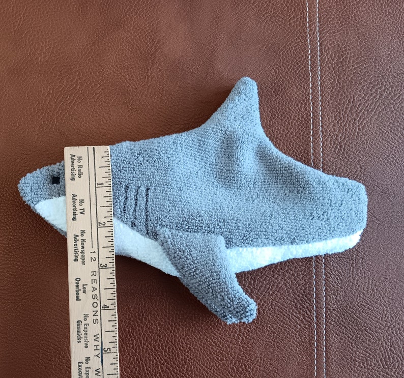 Ruler showing width of mouth of shark. Approximately 2 and a half inches