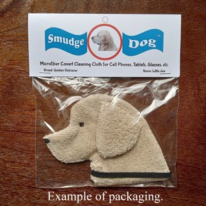 This is a photo that shows an example of the packaging used for Smudge Dogs. Each dog will come in a sandwich sized zip top bag with a card stock hang tag on it. The tag has the Smudge Dog logo as well as the breed and dog name. Directions on back.