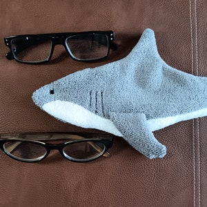 Shark shaped glasses case with two of the glasses it can hold
