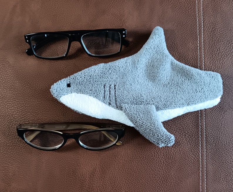 Shark shaped glasses case with two of the glasses it can hold