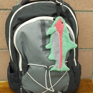 Smudge Fish has a ¼ inch braided elastic loop approximately three inches long that can be looped through a backpack or handbag so that it’s easy to find and use.