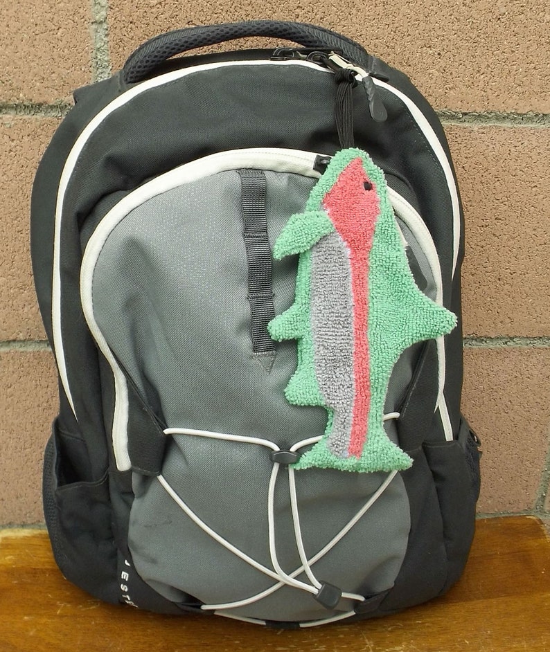 Smudge Fish has a ¼ inch braided elastic loop approximately three inches long that can be looped through a backpack or handbag so that it’s easy to find and use.