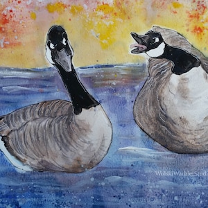 May include: A watercolor painting of two geese on a blue and purple water surface. The geese are facing different directions, with one looking directly at the viewer. The background is a yellow and orange sunset.