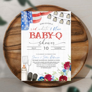 May include: Red, white, and blue baby shower invitation with a watercolor American flag, string lights, and floral accents. The invitation reads "Join us for a red, white & blue baby-q shower" with the date and time of the event. The invitation also includes the names of the parents-to-be, Jamce & John Robenzen, and their address.