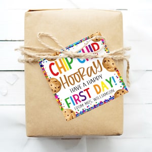 May include: A white gift tag with colorful confetti and chocolate chip cookies. The tag reads "Chip Chip Hooray! Have a Happy First Day! From: Mrs. Williamson".