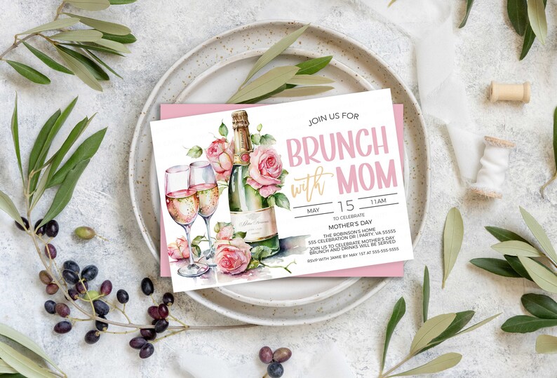 May include: A pink and white invitation card with a watercolor illustration of champagne flutes and roses. The text on the card reads "Join us for Brunch with Mom" and includes details for a Mother's Day celebration.