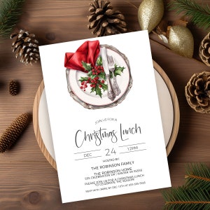 May include: A Christmas lunch invitation featuring a watercolour illustration of a white plate with a red napkin, silver cutlery, and holly berries. The text reads "Join us for a Christmas Lunch, Dec 24, 12PM, Hosted by: The Robinson Family, The Robinson Home, 555 Celebration Dr | Winter VA 55555, Please join us for a Christmas lunch to celebrate the season! RSVP with Jamie by Dec 10th at 555-555-5555."