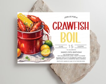 May include: A white invitation card with a red and yellow crawfish boil illustration. The text reads "Join us for a Crawfish Boil" and "June 15 5:00PM to celebrate Jamie's 35th Birthday".