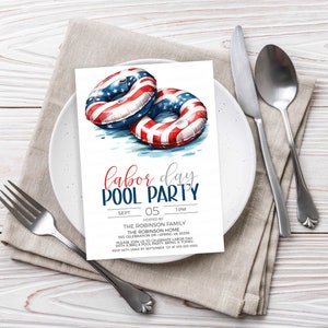 May include: Invitation to a Labor Day pool party hosted by the Robinson family. The invitation features a watercolor illustration of two red, white, and blue inflatable pool rings with stars and stripes. The text reads "Labor Day Pool Party" with the date and time of the party, the address, and RSVP information.