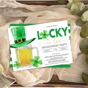 May include: An engagement party invitation with a St. Patrick's Day theme. The invitation features a green leprechaun hat, a mug of beer, and shamrocks. The text reads "Lucky in Love" and includes event details.