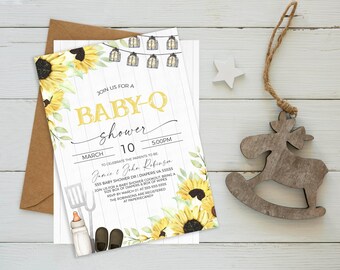 May include: A baby shower invitation with a sunflower and lantern design. The invitation reads "Join us for a Baby-Q Shower" with the date and time. The invitation also includes the names Jamie & John Robinson and the address 555 Baby Shower Dr. Diapers, VA 55555.