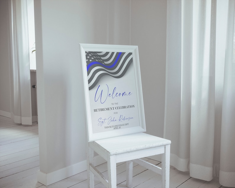 May include: A white framed sign with a blue line flag design and the text "Welcome to the Retirement Celebration for Sgt. John Robinson, Thin Blue Line Police Dept. April 28".