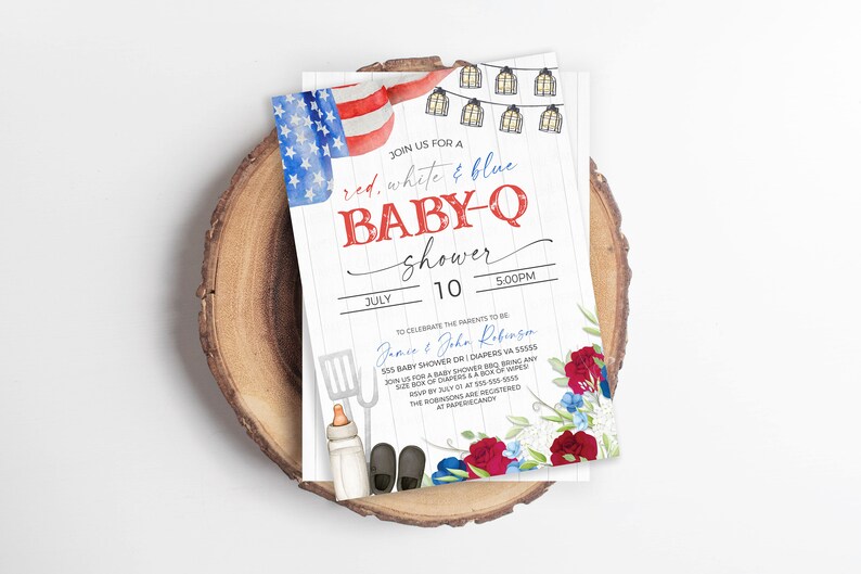 May include: Red, white, and blue baby shower invitation with a watercolor illustration of an American flag, string lights, and red and blue flowers. The invitation text reads "Join us for a red, white & blue baby-q shower" and includes the date, time, and location of the event. It also includes the names of the parents-to-be, "Jonce & John Robinson", and a request for gifts.