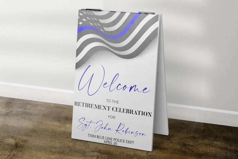 May include: A white sign with a blue line American flag design. The sign says "Welcome to the Retirement Celebration for Sgt. John Robinson Thin Blue Line Police Dept April 20".