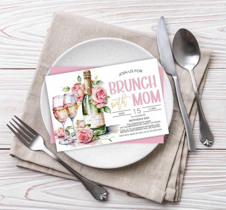 May include: A pink and white invitation card with a watercolor illustration of champagne flutes and a bottle of champagne with pink roses. The text on the card reads "Join us for Brunch with Mom" and includes the date, time, and location of the event.