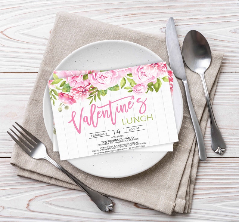 May include: A Valentine's Day lunch invitation with pink floral design. The invitation reads "Valentine's Lunch" with the date "February 14" and time "1:00PM". It also includes the host, "The Robinson Family", and the address "555 Party Dr | Valentines VA 50055".