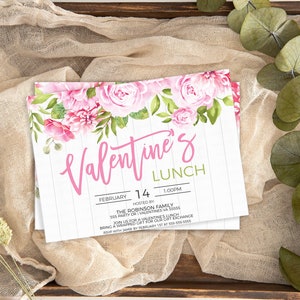 May include: A white invitation with pink floral border and text that reads "Valentine's Lunch" with the date "February 14" and time "1:00PM". The invitation is hosted by "The Robinson Family" and includes the address "555 Party Dr.  Valentine, VA 55555".