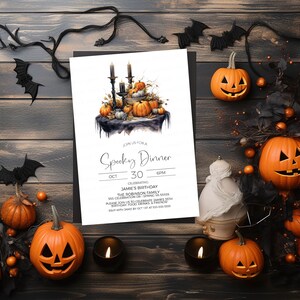 May include: A white invitation card with black text for a Spooky Dinner on October 30th at 6 PM. The invitation features a watercolor illustration of a black table with pumpkins, candles, and a black cauldron. The text reads "Join us for a Spooky Dinner, Oct 30, 6 PM, Celebrating Jamie's Birthday, The Robinson Family, 555 Celebration Dr, Spring VA 55555, Please join us to celebrate James 35th Birthday, Food, Drinks & Friends, RSVP with Jamie by Oct 1st at 555-535-5555."