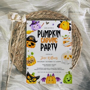 May include: A white invitation card with a pumpkin carving party theme. The card features a variety of cute cartoon pumpkins with different expressions and costumes. The text on the card reads "Join us for a Pumpkin Carving Party", "Hosted by Jamie Williams", "Saturday | October 15 | 4:00PM", "The Spooky Place", "555 Spooky Lane", "Pumpkin Carving & Painting Party!", "Wear a Costume! Food & Drinks Provided", and "RSVP with Ms. Williamson at 555-555-5555".