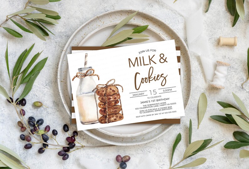 May include: A white invitation card with brown stripes on the edges. The card has a watercolor illustration of a bottle of milk and a stack of chocolate chip cookies. The text on the card reads "Join us for Milk & Cookies" and "January 15, 5:00PM to celebrate Jamie's 1st Birthday".