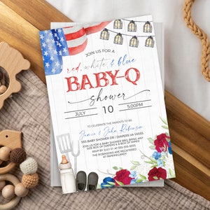 May include: Red, white, and blue baby shower invitation with a watercolor American flag, string lights, and floral accents. The invitation reads "Join us for a red, white & blue baby-q shower" with the date and time of the event.