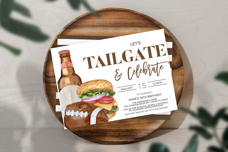 May include: A white invitation card with brown text that reads "Let's Tailgate & Celebrate". The card features a watercolor illustration of a hamburger, a bottle of beer, and a football. The text on the card includes the date "January 15" and the time "5:00PM". The invitation is for Jamie's 35th birthday party.