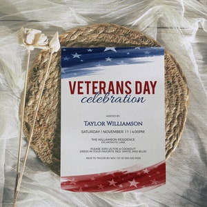 May include: Veterans Day celebration invitation with a red, white, and blue watercolor background. The invitation includes the date, time, and location of the event. It also requests an RSVP by November 1st.