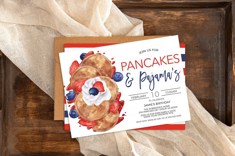 May include: A white invitation card with blue and red stripes on the bottom. The card has a watercolor illustration of pancakes with whipped cream, strawberries, and blueberries. The text on the card reads "Join us for Pancakes & Pajama's!"  "February 10, 10:00 AM" "To Celebrate Jamie's Birthday" "The Robinson's Home 555 Pancake Dr. Syrup, VA 55555" "Join us for pancakes & juice" "Wear your favorite PJs" "RSVP with Jamie by Jan 1st at 555-555-5555"
