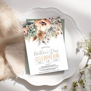 May include: A floral-themed invitation for a Mother's Day celebration. The invitation features a watercolour illustration of flowers in shades of peach, green, and brown. The text reads "Join us for a Mother's Day Celebration, May 15, 11 AM, Hosted by The Robinson Family".