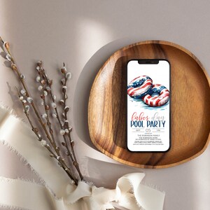 May include: A digital invitation for a Labor Day pool party. The invitation features a watercolor illustration of two red, white, and blue inflatable pool rings. The text on the invitation reads "Labor Day Pool Party" with the date "Sept 05" and the time "1 PM".